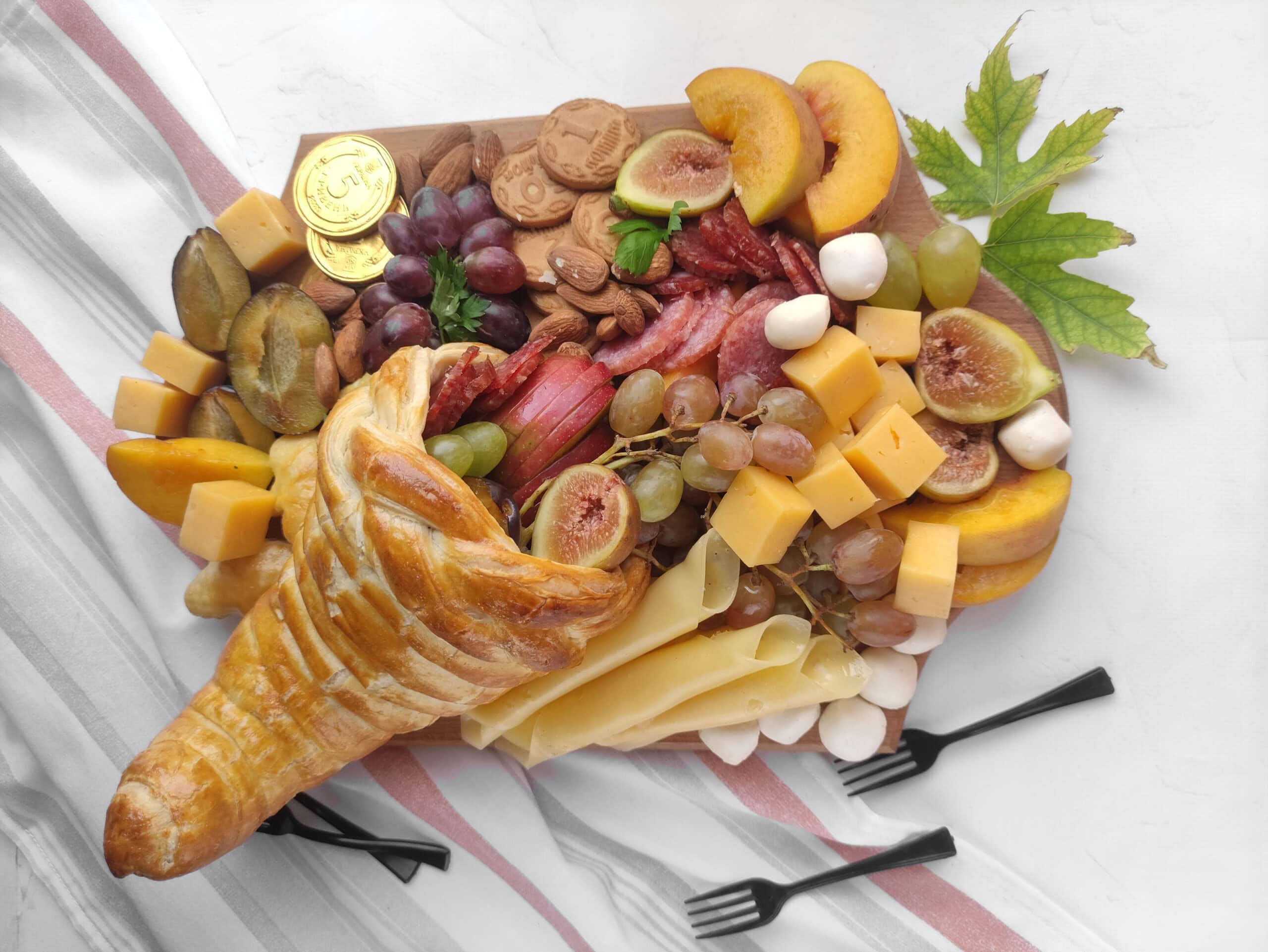 Cornucopia Charcuterie Board with Fresh and Savory Treats